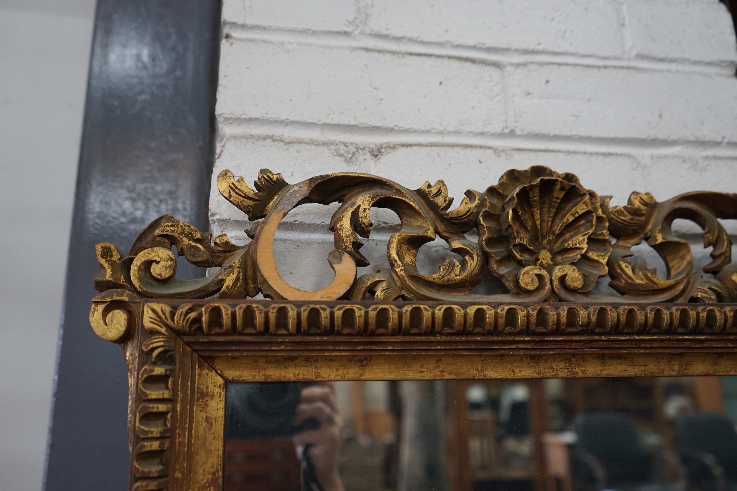 An 18th century style giltwood wall mirror, width 57cm, height 94cm